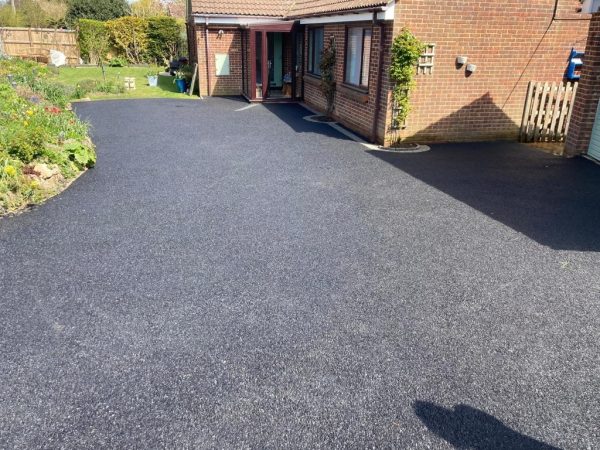 New tarmac installation on a driveway in Cirencester